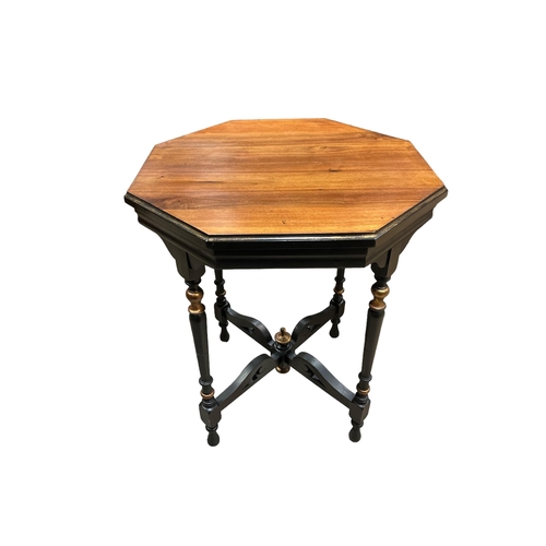 436 - A VINTAGE WALNUT EBONISED AND PARCEL GILT OCTAGONAL TABLE on turned legs joined by pierced cross str... 