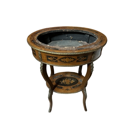 435 - A CONTINENTAL KINGWOOD MARQUETRY AND GILT BRASS MOUNTED JARDINIERE STAND of oval outline on cabriole... 