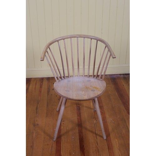 447 - ERIC CONNOR An ash wood Windsor chair with spindle back and shaped seat