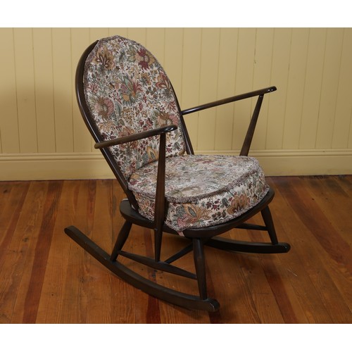 451 - A VINTAGE ERCOL ROCKING CHAIR with loose cushions