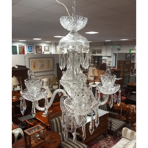 495 - A TARA CRYSTAL FOUR BRANCH CHANDELIER with spiral twist scroll arms hung with faceted pendants 60cm ... 