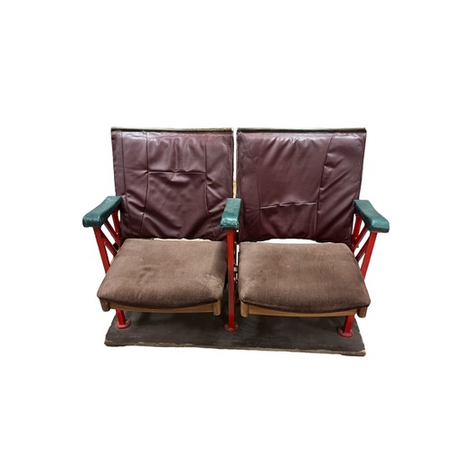 655 - A PAIR OF VINTAGE CAST IRON FAUX LEATHER AND VELVET UPHOLSTERED CINEMA SEATS on pine base 108cm (w)