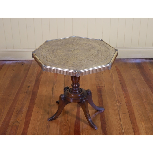 1 - A BRASS BANARES ENGRAVED TABLE of octagonal outline on quadruped splayed legs 59cm (h) x 61cm (w) x ... 