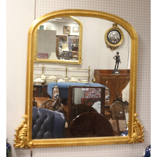 160 - A VICTORIAN STYLE GILT FRAME OVERMANTEL MIRROR the rectangular arched plate within a beadwork open f... 