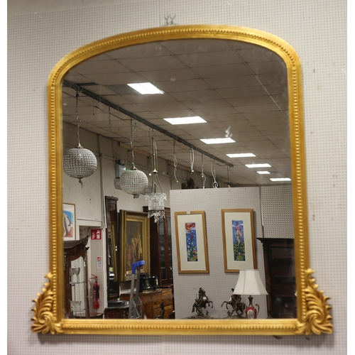 172 - A VICTORIAN STYLE GILT FRAME OVERMANTEL MIRROR the rectangular arched plate within a beadwork moulde... 