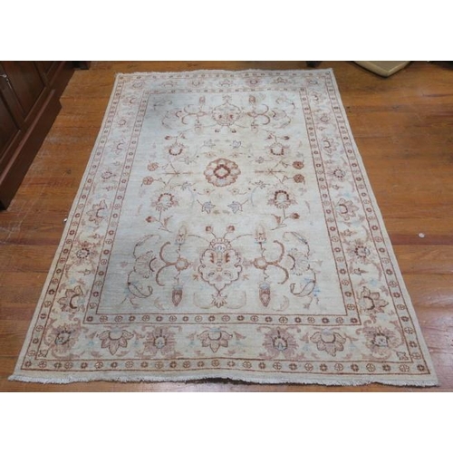 176 - A WOOL RUG the beige ground with central floral panel within a conforming border 235cm (l) x 169cm (... 