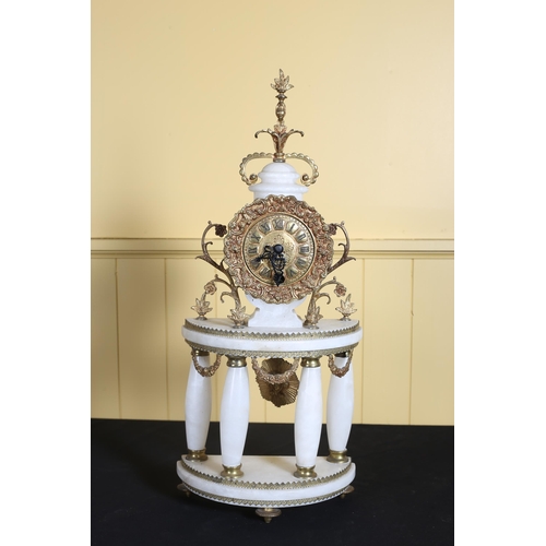 185 - A CONTINENTAL WHITE ONYX AND GILT BRASS PORTICO CLOCK the embossed dial with Roman numerals on shape... 