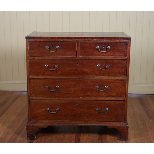 199 - A GEORGIAN MAHOGANY CHEST of two short and three long graduated drawers with brass drop handles on b... 