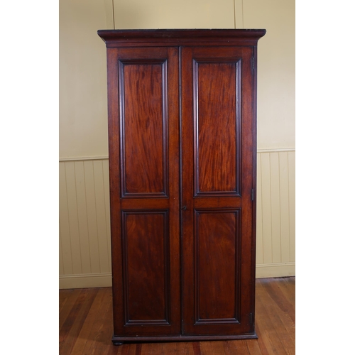 21 - A 19TH CENTURY MAHOGANY CUPBOARD with panel doors containing six open shelves on moulded base 224cm ... 