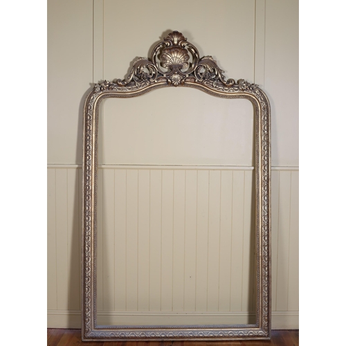 24 - A CONTINENTAL GILT FRAME the beadwork and foliate frame with shell cresting (lacking mirror) 230cm (... 