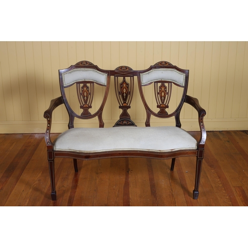 26 - AN EDWARDIAN MAHOGANY INLAID AND UPHOLSTERED DOUBLE CHAIR BACK SETTEE with pierced splats and uphols... 