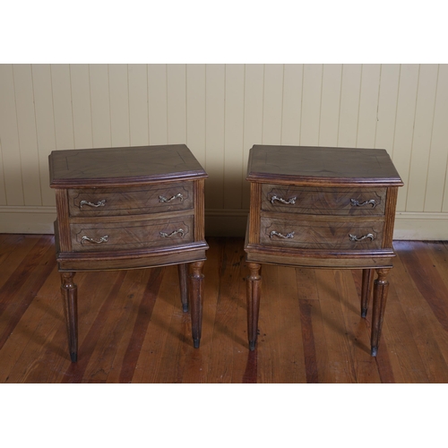 30 - A PAIR OF CONTINENTAL KINGWOOD CHESTS each of rectangular bowed outline with two frieze drawers on c... 