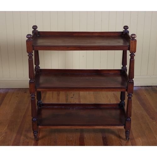 35 - A WILLIAM IV MAHOGANY THREE TIER DUMBWAITER each open shelf joined by lobed supports with brass caps... 