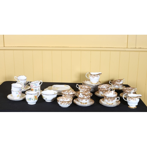 374 - A FORTY PIECE ARKLOW POTTERY CHINA TEA SET the white ground with floral decoration, a fifteen piece ... 