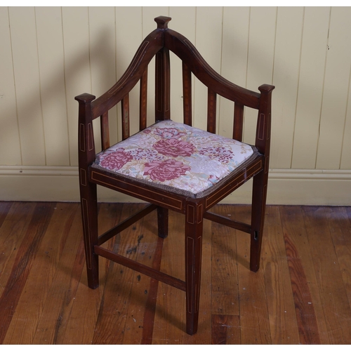 383 - AN EDWARDIAN MAHOGANY INLAID AND UPHOLSTERED CORNER CHAIR the shaped top rails with vertical splat a... 