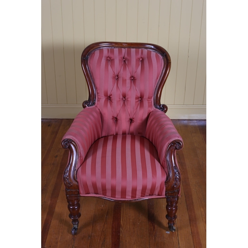 39 - A 19TH CENTURY MAHOGANY AND UPHOLSTERED GENT'S CHAIR with deep buttoned upholstered back and scroll ... 