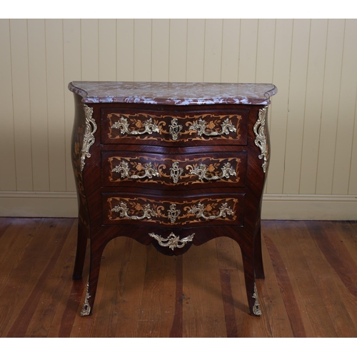 397 - A CONTINENTAL KINGWOOD INLAID GILT BRASS MOUNTED CHEST of bombe outline surmounted by a rouge veined... 