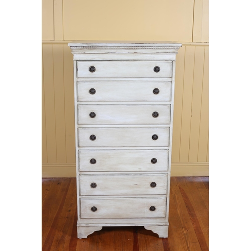 4 - A VINTAGE PAINTED TALLBOY with dentil moulded cornice above seven long graduated drawers with brass ... 