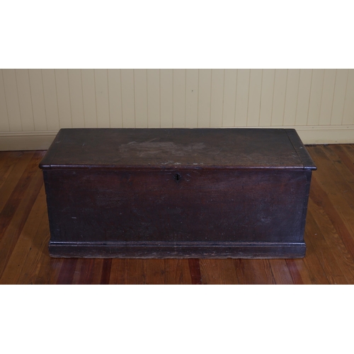 413 - A 19TH CENTURY OAK CHEST the rectangular hinged lid above a moulded apron on platform base with stee... 