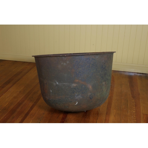 419 - A LARGE 19TH CENTURY CAST IRON POT of cylindrical tapering form 67cm (h) x 92cm (d)