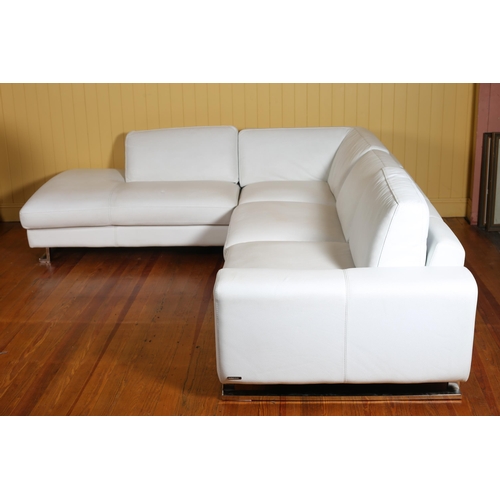 420 - A ROCHE BOBOIS WHITE HIDE UPHOLSTERED L-SHAPED SETTEE with loose cushions 70cm (h) x 240cm (w) x 275... 