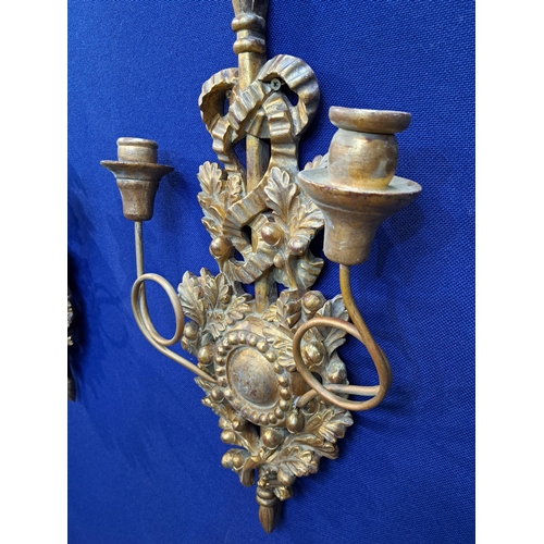 474 - A PAIR OF GILTWOOD TWO BRANCH WALL SCONCES each with a ribbon tied and foliate backplate issuing two... 