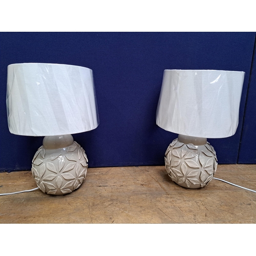 481 - A PAIR OF CERAMIC TABLE LAMPS each of bulbous form with leaf decoration with shades 55cm (h) x 35cm ... 