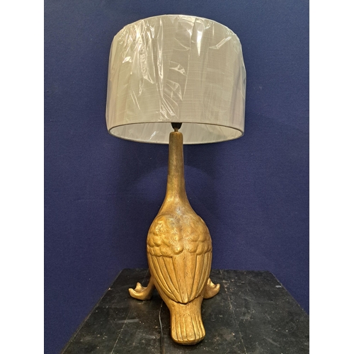 483 - A GILT TABLE LAMP in the form of a duck with shade 60cm (h) x 30cm (d)