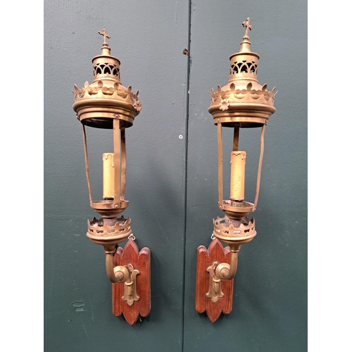 484 - A PAIR OF GOTHIC STYLE BRASS PROCESSION LANTERNS with gothic tracery finials and hardwood backplates... 