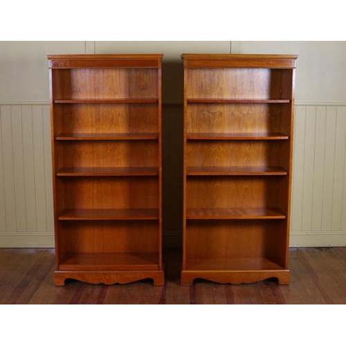 49 - A PAIR OF CHERRYWOOD FIVE TIER OPEN FRONT BOOKCASES with four adjustable shelves on bracket feet 165... 