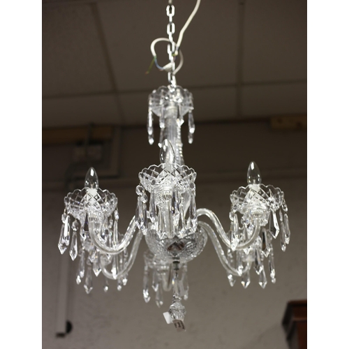 494 - A WATERFORD CUT GLASS SIX BRANCH CHANDELIER hung with faceted pendants 66cm (drop)