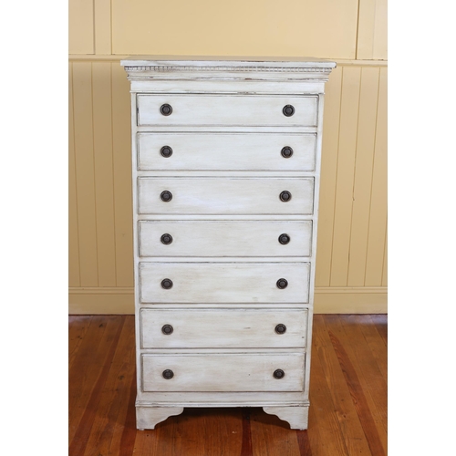 5 - A VINTAGE PAINTED TALLBOY with dentil moulded cornice above seven long graduated drawers with brass ... 