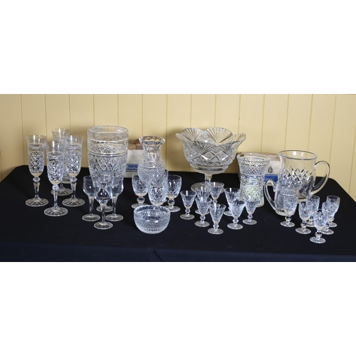 516 - A COLLECTION OF GLASSWARE to include some Waterford cut glass drinking glasses, Waterford cut glass ... 