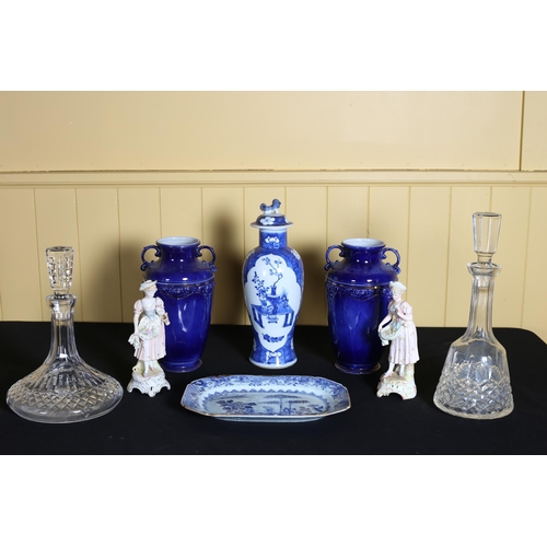 518 - A WATERFORD CUT GLASS SHIP'S DECANTER with stopper, a cut glass spirit decanter with stopper, a pair... 