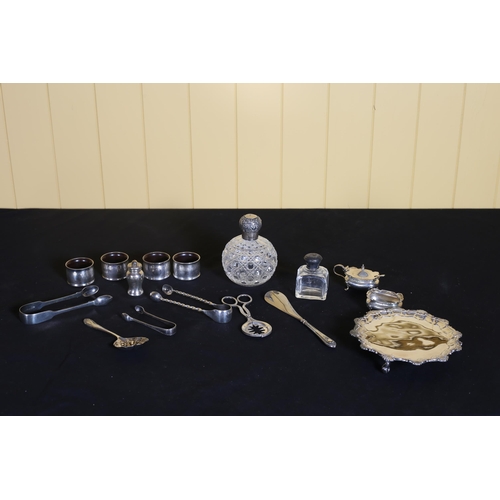 528 - A SET OF FOUR SILVER ENGINE TURNED SERVIETTE RINGS, a cut glass and silver top perfume bottle, three... 