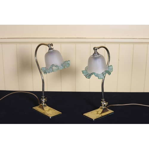 537 - A PAIR OF VINTAGE BRASS TABLE LAMPS each with a shaped arm with adjustable shade on a rectangular ba... 