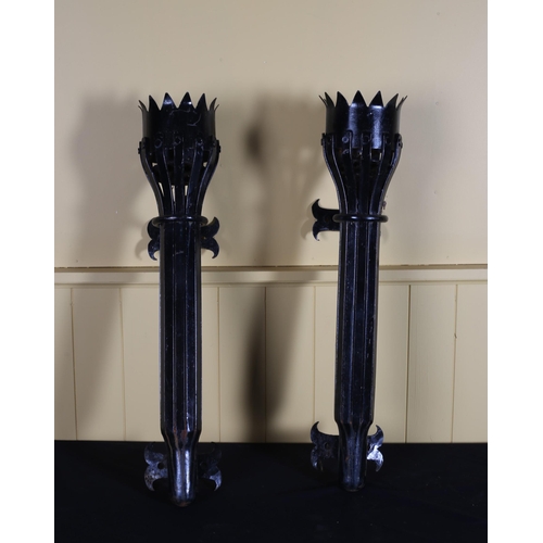 555 - A PAIR OF VINTAGE CAST IRON WROUGHT IRON WALL MOUNTED LIGHTS in the form of a torch 67cm (h)