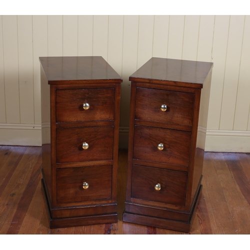 556 - A PAIR OF VINTAGE WALNUT CHESTS each of rectangular outline with three deep frieze drawers on steppe... 