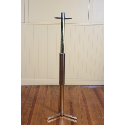 561 - A VINTAGE BRASS CANDLESTICK the cylindrical column with drip pan on tripod base 153cm (h)