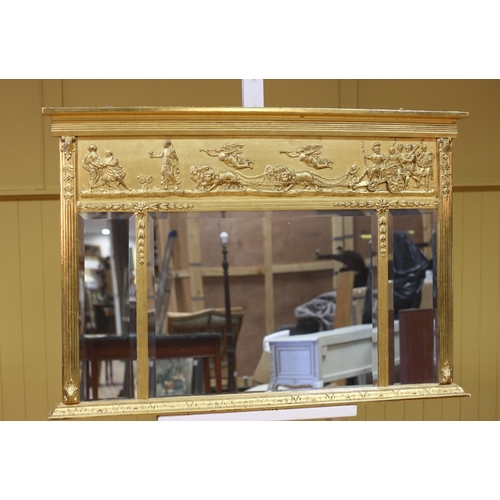 577 - A REGENCY STYLE COMPARTMENTED OVERMANTEL MIRROR the frieze moulded in relief with lion drawn chariot... 