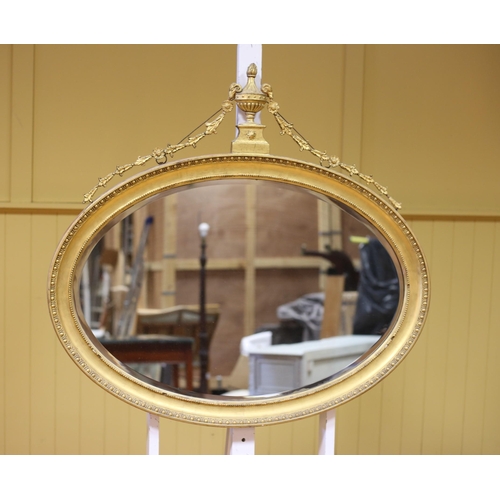 578 - AN ADAM DESIGN GILTWOOD AND GESSO MIRROR the oval plate within an egg and dart and beadwork frame wi... 