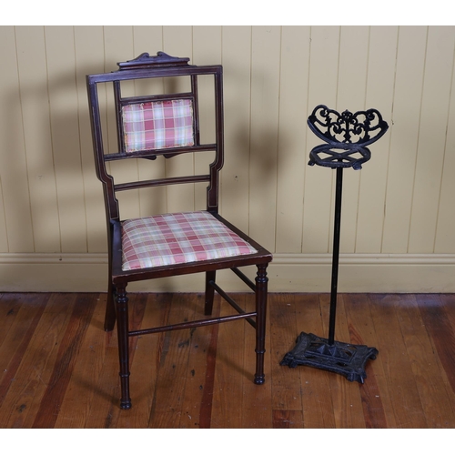 60 - AN EDWARDIAN MAHOGANY INLAID AND UPHOLSTERED OCCASIONAL CHAIR, a cast iron four compartment stick st... 