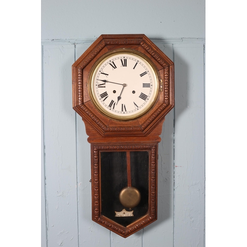 606 - A VINTAGE OAK CASED DROP DIAL WALL CLOCK the octagonal case containing a white painted dial with Rom... 