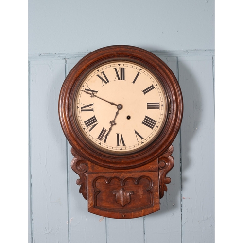 607 - A 19TH CENTURY OAK GOTHIC STYLE WALL CLOCK the circular shaped case with painted dial and Roman nume... 