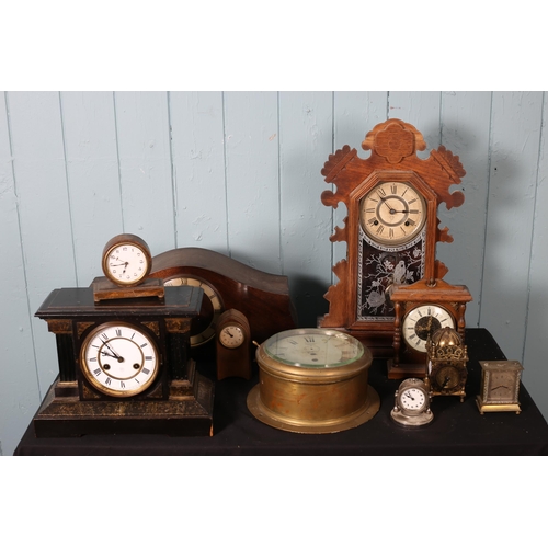 618 - A COLLECTION OF VARIOUS CLOCKS to include four brass dome clocks, etc.