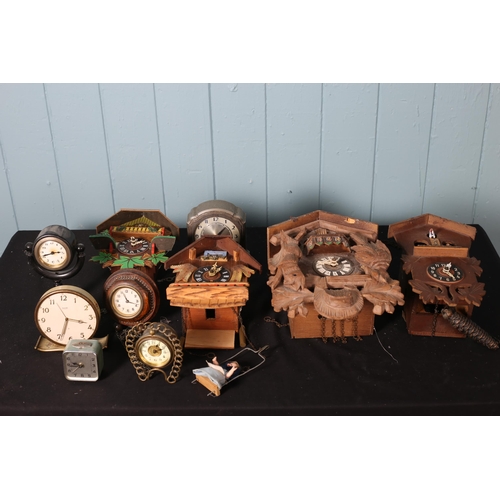 618 - A COLLECTION OF VARIOUS CLOCKS to include four brass dome clocks, etc.