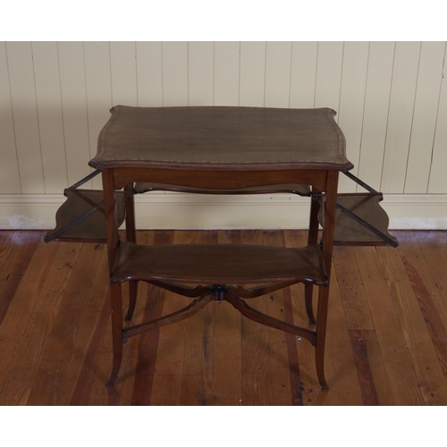 65 - AN EDWARDIAN MAHOGANY AND SATINWOOD INLAID TEA TABLE of serpentine outline with four hinged leaves o... 