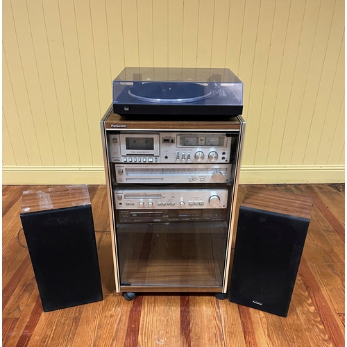 714 - A PANASONIC RACK SYSTEM STEREO with turntable and speakers in teak case