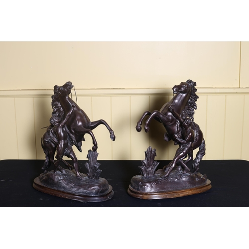 79 - A PAIR OF VINTAGE GILT SPELTER MARLEY HORSES with handlers on hardwood bases 43cm (h)