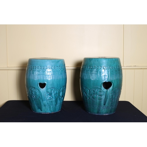 84 - A PAIR OF CHINESE SEATS each of cylindrical tapering form with pierced handles the turquoise glazed ... 